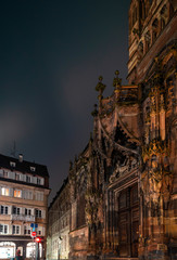 Fototapeta premium The side facade of the Cathedral in Strasbourg, richly decorated with sculptural compositions