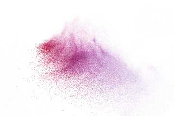 Freeze motion of purple color powder exploding on white background.