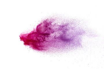 Freeze motion of purple color powder exploding on white background.
