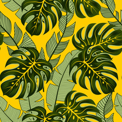Original seamless tropical pattern with colorful plants and leaves on a yellow background.  Exotic tropics. In summer, colorful Hawaiian seamless pattern with tropical plants.