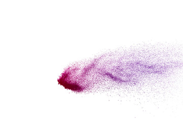 Fototapeta premium Freeze motion of purple color powder exploding on white background.