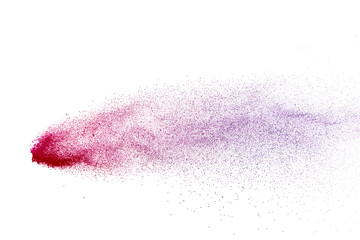 Freeze motion of purple color powder exploding on white background.