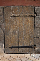 Old wooden door of medieval house.