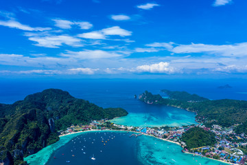 Beautiful panoramic view over Tonsai and Dalum Beach. Green jungles and hot stones on the bright sun of tropical island and the mountains in Andaman Sea. Phi Phi Viewpoint, Krabi, Thailand