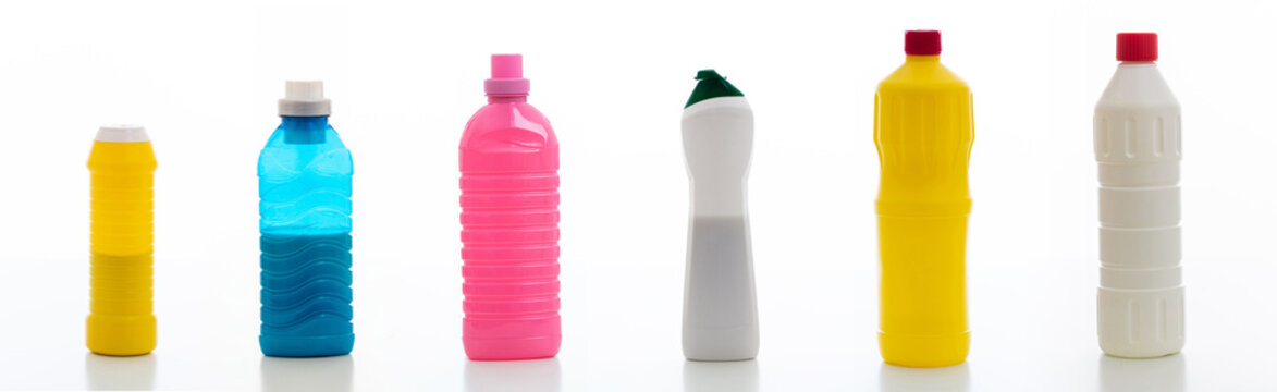 Cleaning supplies bottles set isolated against white background.