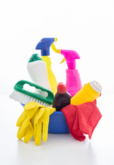 Cleaning supplies in a blue bowl isolated against white background.