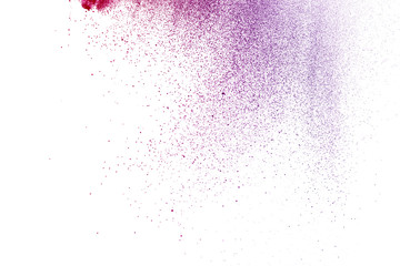 Freeze motion of purple color powder exploding on white background.