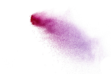 Freeze motion of purple color powder exploding on white background.