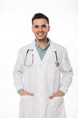 Smiling doctor with stethoscope looking at camera isolated on white