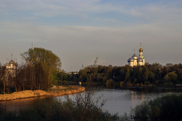 Vologda. Beautiful spring evening on the Vologda river Bank. Church Of The Meeting Of The Lord. 18th century; St. Sophia Cathedral