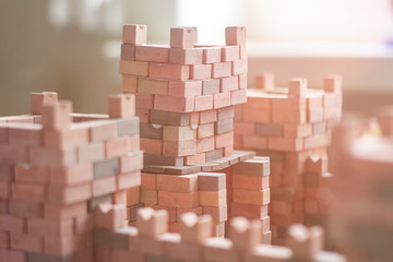 Fototapeta na wymiar Cubes castle.Сastle brick wall.Toy tower