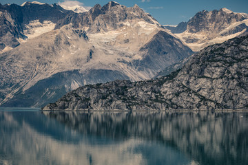 Reflection of Rugged mountains in Inside Passage of Alaska