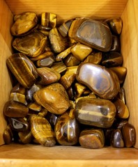 A pile of beautiful gold and brown Tiger's Eye stones