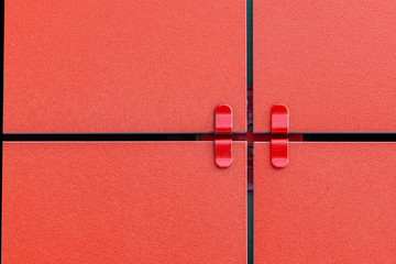Red ceramic composite panel wall. Fragment of a ventilated facade