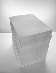 Stack of office paper, on a white background. Concept, minimalism