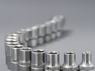 auto repair wrenches on a gray background