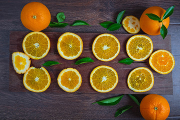 Orange slices on wooden background