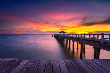 Landscape of Wooded bridge in the port between sunrise
