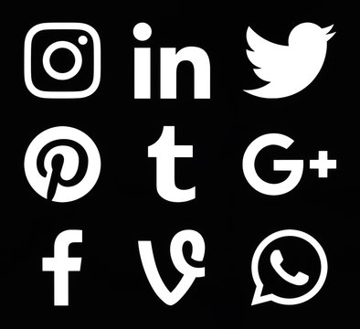 Kiev, Ukraine - November 26, 2016: Collection of popular white social media icons printed on black paper: Instagram, Linkedin, Twitter, Pinterest, Tumblr, Google Plus, Facebook, Vine and WhatsApp