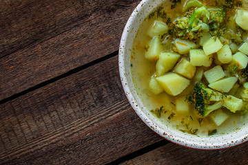 soup broccoli, broth and other vegetables (vegetarian first course) menu concept. background. top view. copy space