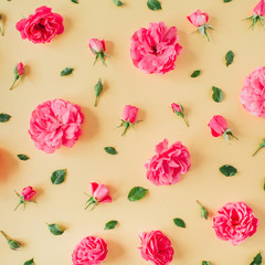 Pink rose flowers pattern on yellow background. Flat lay, top view. Valentine's day collage.