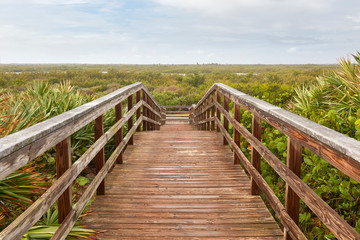 Fototapeta na wymiar Boardwalk to/from the beach at Cape Canaveral National Seashore, Florida