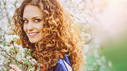 Attractive young woman in sunlight in nature
