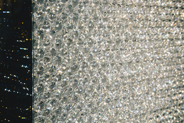 Beautiful shiny diamonds swarovski crystal background. Luxury, wealth. Cover pattern. Macro photo, close up of expensive stones.