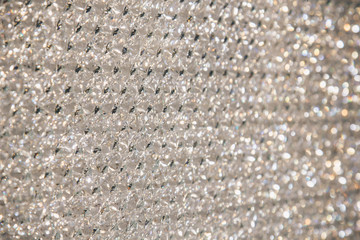 Beautiful shiny diamonds swarovski crystal background. Luxury, wealth. Cover pattern. Macro photo, close up of expensive stones.