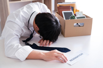 Businessman has stress to resignation and signing cancellation contract letter, Change of job unemployment or resign concept