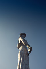 Georgian Culture and Travel concept. Statue of mother of Georgia in Tbilisi. Sunny weather with blue sky. Copy-space. Outdoor shot