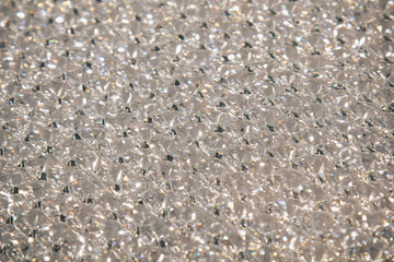 Beautiful shiny diamonds swarovski crystal background. Luxury, wealth. Cover pattern. Macro photo, close up of expensive stones.