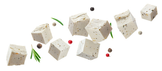Falling feta cubes with herbs isolated on white background - obrazy, fototapety, plakaty