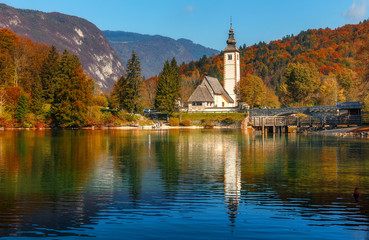 Amazing nature landscape. Beautiful view of famous alpine lake Bohinj, Church of St John the...