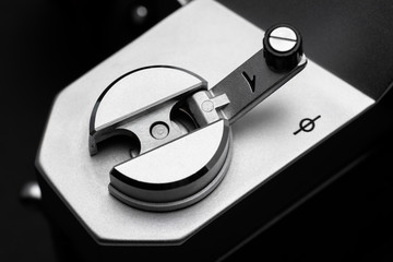 Focal plane mark next to a rewind crank on a retro film camera