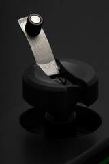 Rewind crank of a black retro film camera