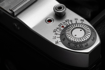 Depth of field scale and shutter release button of old film camera