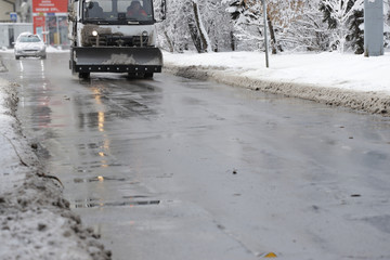 Snowplow on a cleaned road. Snow cleaning machine