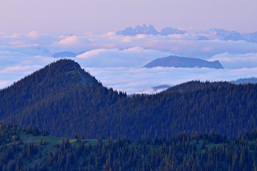 Twilight landscape of mountains in clouds outside of Mt. Ranier National Park, Washington, USA