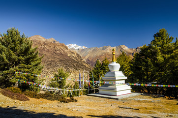White stupa on the way to Milarepa`s cave in Marshyangdi river valley near Bhraka (Braga) village....