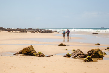 Old couple hiking along the beach of Cape St Francis
