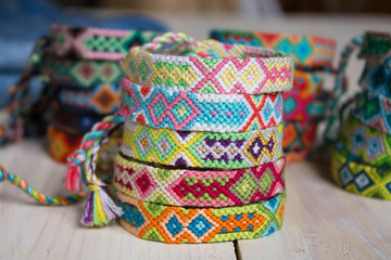 Fototapeta na wymiar close-up isolated lots of colorful variety bracelets of handmade