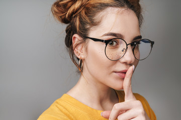Close up of a cute young teenage girl wearing glasses