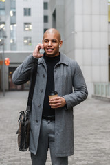 Attractive young african man wearing autumn coat