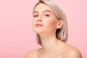 beautiful sensual girl with pink makeup, isolated on pink