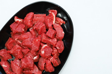 raw meat on black plate
