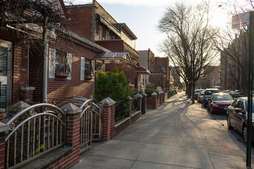 Beautiful Old Brick Homes along the Sidewalk in Astoria Queens New York