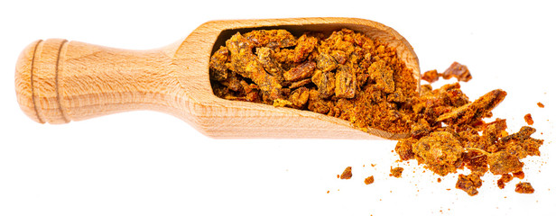  wooden spoon of propolis granules isolated