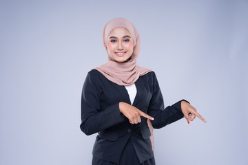 Half length portrait of an attractive Muslim businesswoman wearing hijab with mixed poses and gestures isolated on grey background. For image cutout for corporate, technology, business or finance.