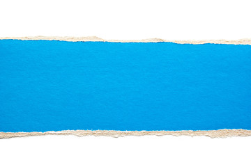 Blue torn stripe of cardboard paper on white background. Copy space for text message.